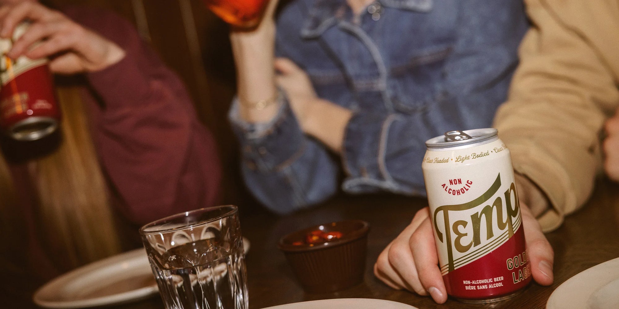 Three people drinking Templ at a restaurant